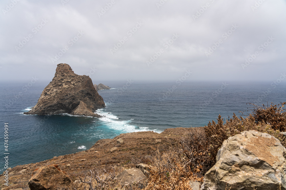 Natural landscape of the northern part of the island in Las Palmas De Anaga. In the background, the Atlantic Ocean and Roques de Anaga. Tenerife. Canary Islands. Spain. Natural landscape of the northern part of the island in Las Palmas De Anaga. In the background, the Atlantic Ocean and Roques de Anaga. Tenerife. Canary Islands. Spain.