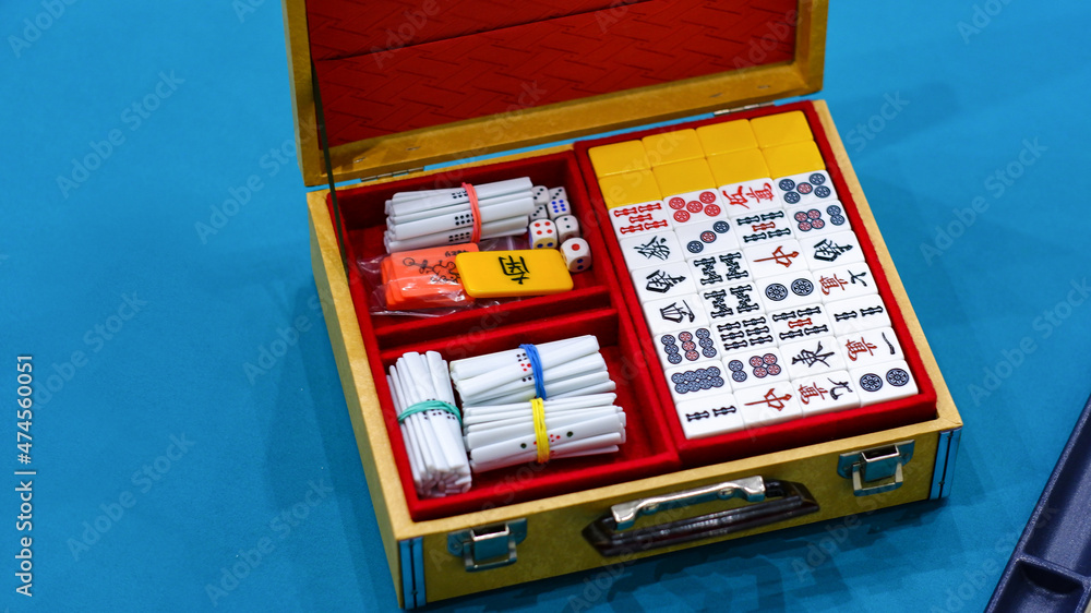 Mahjong board game set. An ancient Asian game called Mahjong as a way to  have fun and have some fun. Stock Photo | Adobe Stock