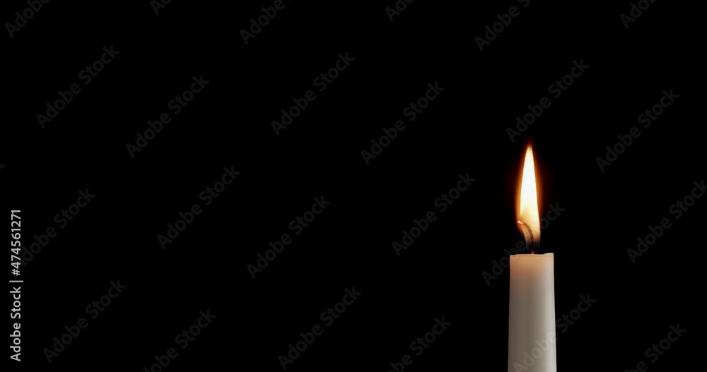 Candle on a black background. The flame of the candle slowly flickers. One candle slowly flickers. Ideal for background or over-layer with blending mode add, screen, lighten. Candle on a black background. The flame of the candle slowly flickers. One candle slowly flickers. Ideal for background or over-layer with blending mode add, screen, lighten.