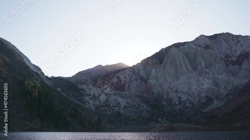 Static shot of Convict Lake California as sun sets over mountain peak 