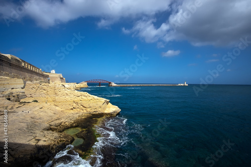 The gateway to the waters of Valletta. Lighthouse. Coast of the island of Malta.
