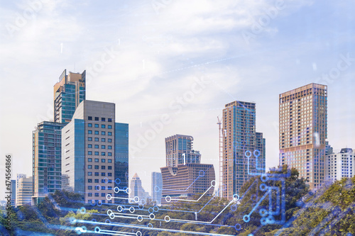 Technology hologram over panorama city view of Bangkok. The largest tech hub in Southeast Asia. The concept of developing coding and high-tech science. Double exposure. © VideoFlow