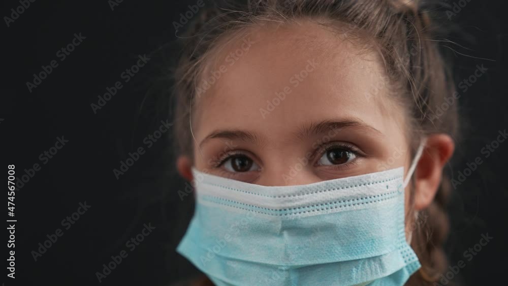 Girl in protective mask. Child face in safety mask. Prevention of diseases by virus. Portrait of girl in protective mask. Schoolgirl in medical mask. Close-up of child face. Fighting virus at school Girl in protective mask. Child face in safety mask. Prevention of diseases by virus. Portrait of girl in protective mask. Schoolgirl in medical mask. Close-up of child face. Fighting virus at school