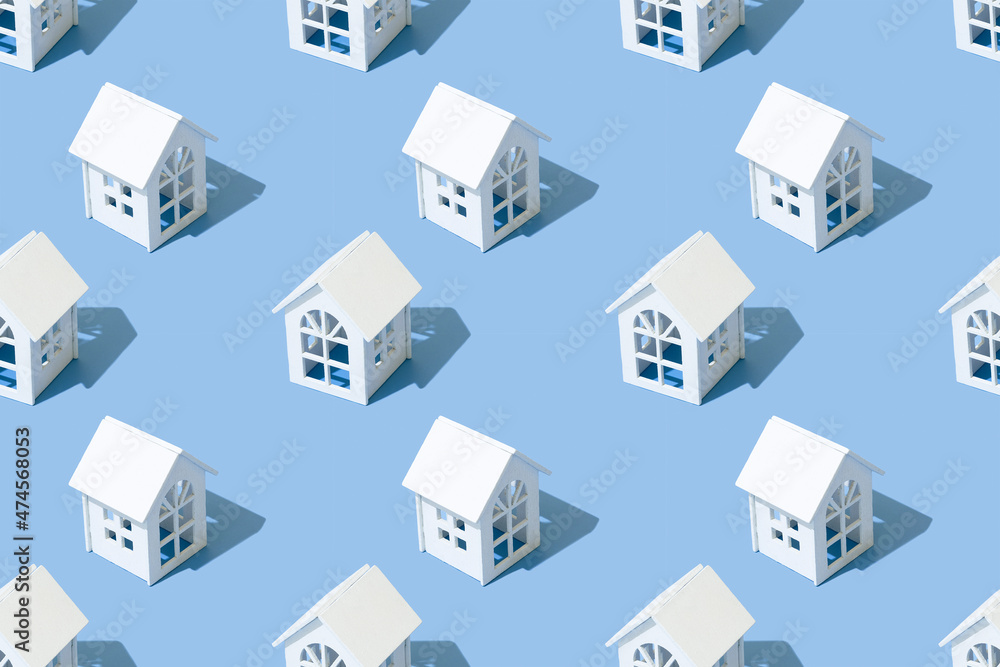 Seamless pattern of houses on a blue background. Seamless pattern of houses on a blue background.