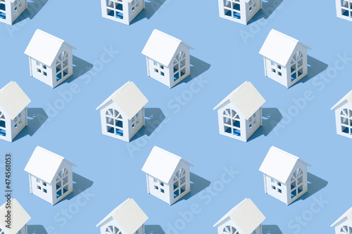 Seamless pattern of houses on a blue background.