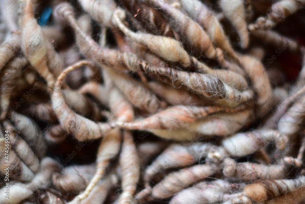 background photo of textured handspun art yarn background photo of textured handspun art yarn