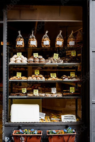 Shelves with various cakes in the pastry store
