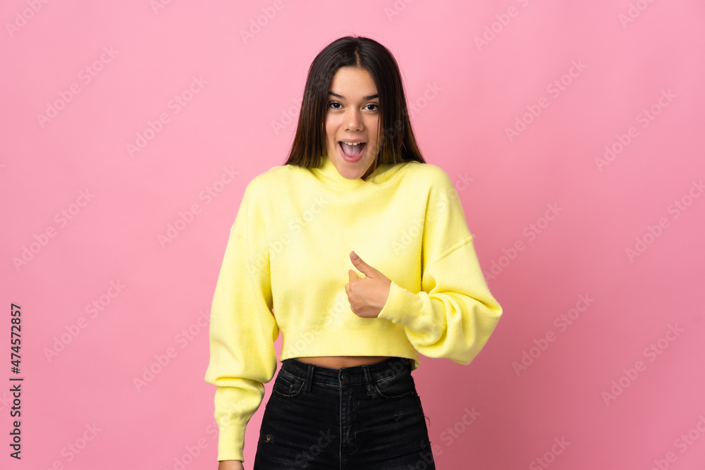 Teenager girl isolated on pink background with surprise facial expression Teenager girl isolated on pink background with surprise facial expression