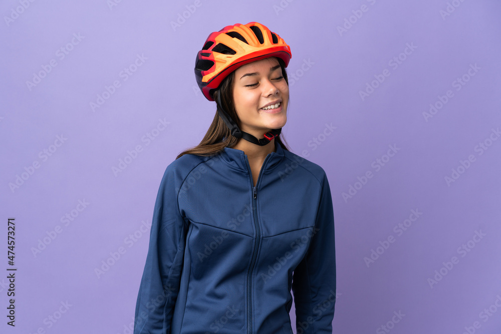Teenager cyclist girl looking to the side and smiling Teenager cyclist girl looking to the side and smiling