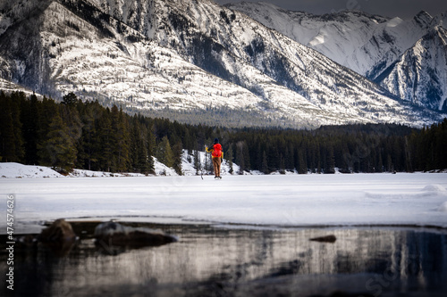 Sticker A hockey player having a break while playing on a frozen mountain lake in Banff