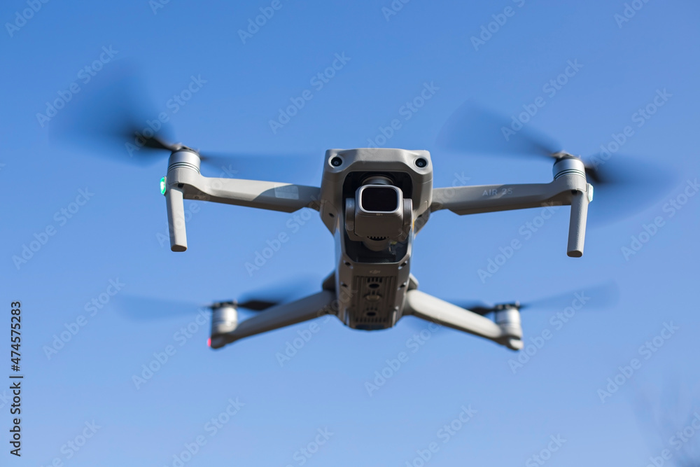 Ukraine, Nikolaev - November 21, 2021 Drone with a quadrocopter with a camera flying in the air. Drone Air 2S