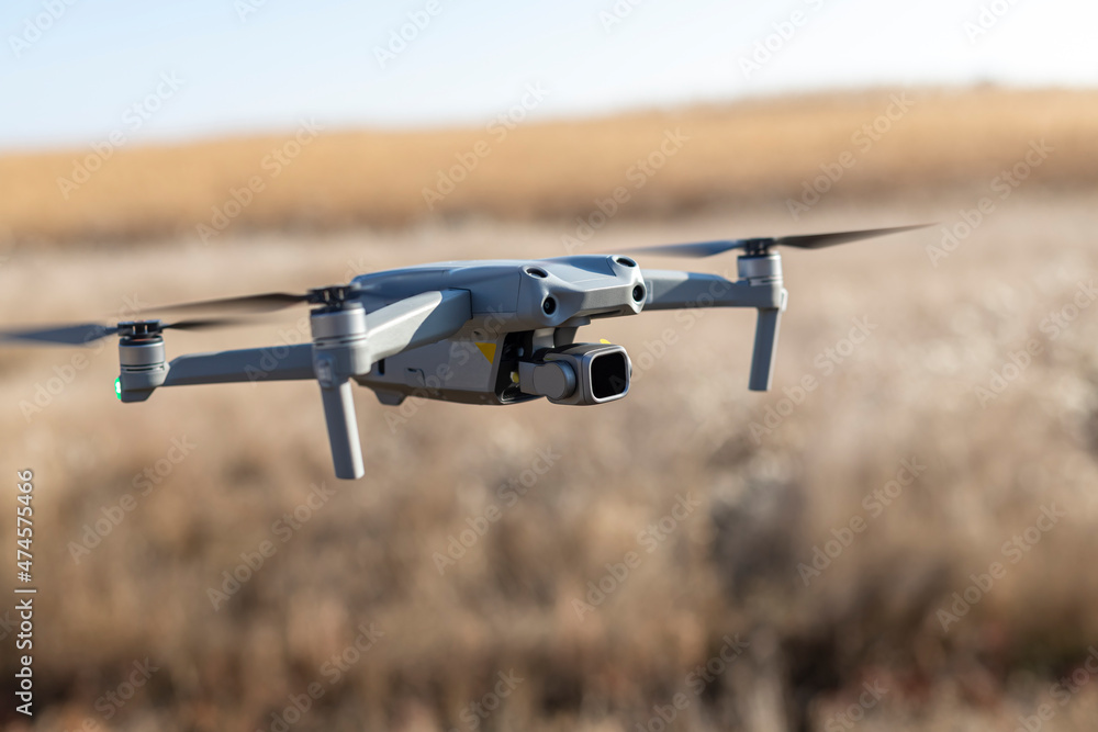 close up photo of flying drone with digital camera close up photo of flying drone with digital camera
