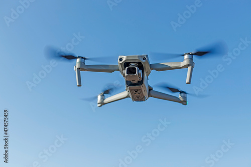 bottom view of a drone flying in the air. Place for text