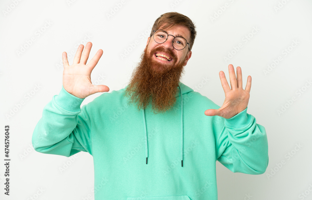 Fototapeta premium Young reddish caucasian man isolated on white background counting ten with fingers