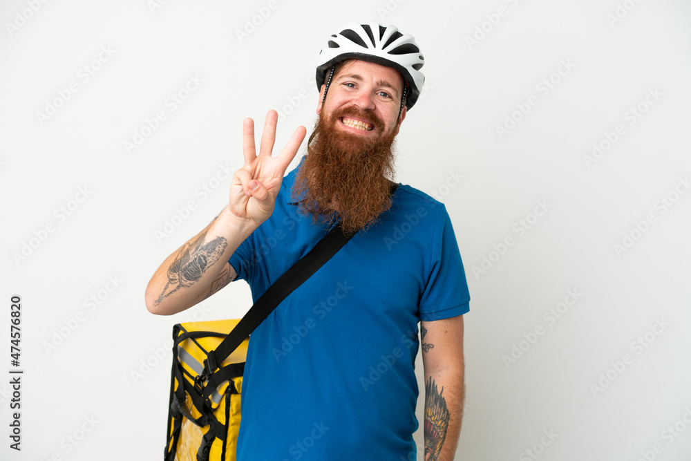 Young reddish caucasian man with thermal backpack isolate don white background happy and counting three with fingers Young reddish caucasian man with thermal backpack isolate don white background happy and counting three with fingers