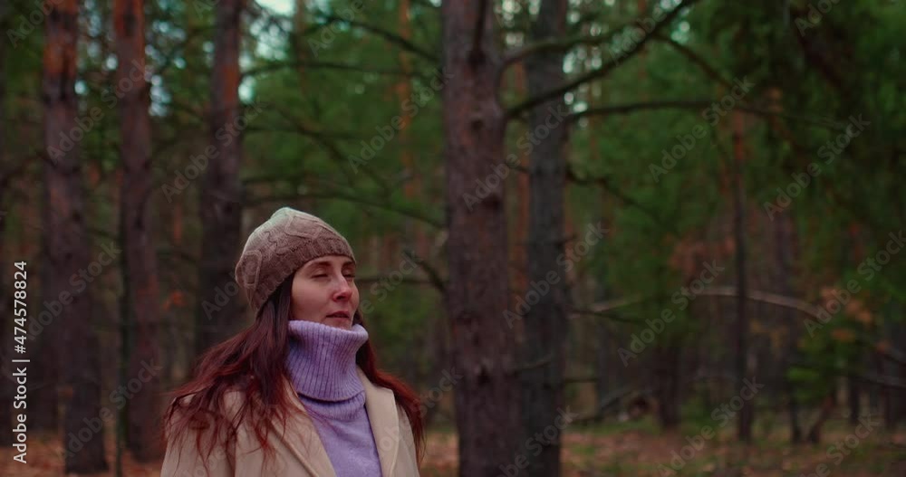 Portrait, a young woman takes a deep breath in a pine forest. Healthy breathing, clean environment. Coniferous forest, tall pines and firs. 4k, ProRes Portrait, a young woman takes a deep breath in a pine forest. Healthy breathing, clean environment. Coniferous forest, tall pines and firs. 4k, ProRes