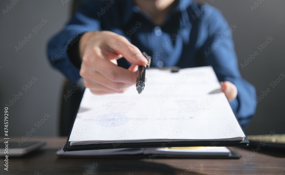 Businessman giving business contract and pen. Businessman giving business contract and pen.