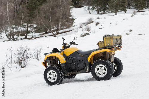 All-terrain vehicle. Quad vehicle in the snow. 