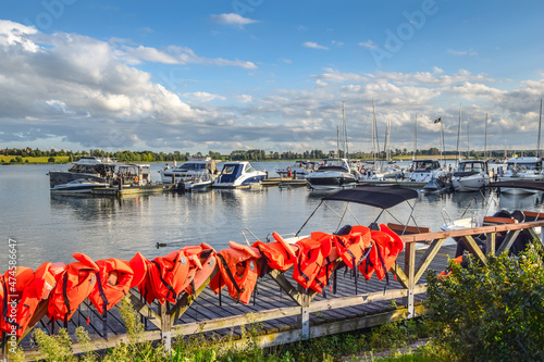 Fototapeta Naklejka Na Ścianę i Meble -  Boats moored at the marina in Ryn (ger. Rhein) at Ryn Lake, Masuria, Poland