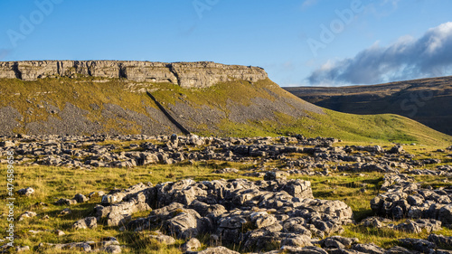 Hill walking the Norber Eratics around Austwick in Craven in  the Yorkshire Dales photo