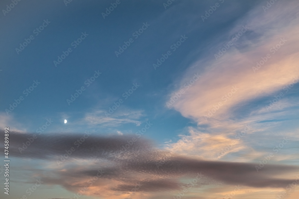 Summer evening sky in the picturesque clouds, lit by the rays of the setting sun. Summer evening sky in the picturesque clouds, lit by the rays of the setting sun.