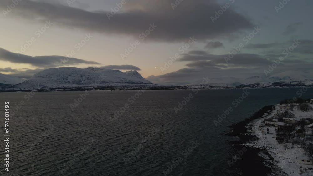 Sunset And Ocean View Of Norway As The Sun Sets During A Polar Night - aerial shot Sunset And Ocean View Of Norway As The Sun Sets During A Polar Night - aerial shot
