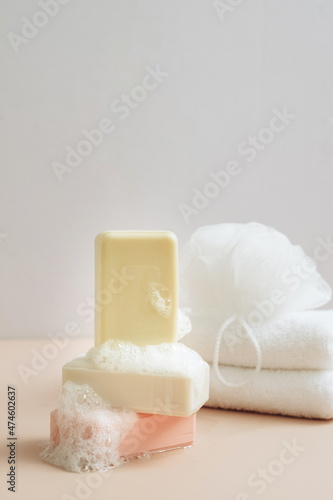 Natural organic handmade soap with large bubbles foam washcloth pastel background. Concept of using natural products