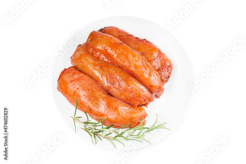 Fresh marinated chicken meat.Raw marinated chicken fillet in red sauce on white isolated background, copy space.