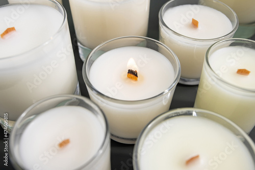 Obraz na plátně Handmade soy candle in glass cup with wooden wick