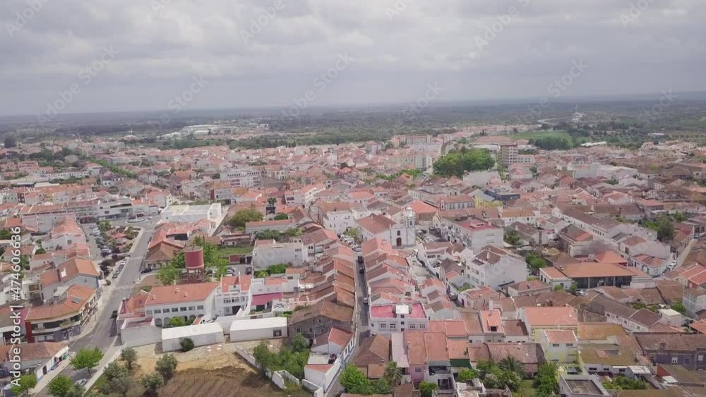 Aerial drone shot flying over the terracotta roofs in Grandola, a small town in Portugal. Flying forwards on a cloudy day. Aerial drone shot flying over the terracotta roofs in Grandola, a small town in Portugal. Flying forwards on a cloudy day.
