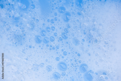 Abstract background white soapy foam texture. Shampoo foam with bubbles
