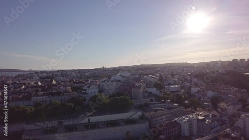 Lisbon Portugal Aerial Drone Shot. Tracking left to right past a park in principe real at sunset. photo