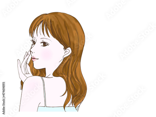 美容に使えそうな振り向く女性_頬に手
