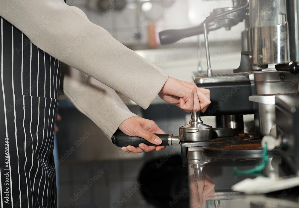 Barista hands making coffee with coffee machine