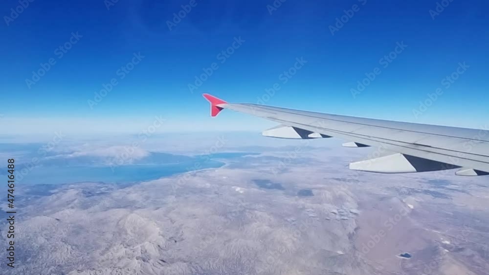 flight. wing of the aircraft in flight from the window of the aircraft above ground. air travel. comfort and speed of travel by plane. promotions and discounts on tickets. flight. wing of the aircraft in flight from the window of the aircraft above ground. air travel. comfort and speed of travel by plane. promotions and discounts on tickets.