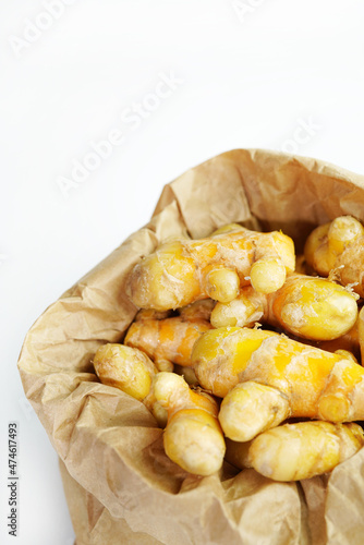 Fresh turmeric on white background,raw material for cooking. Close up.