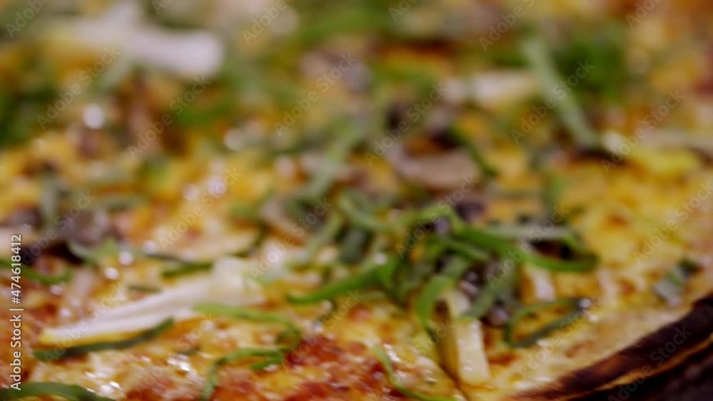 Vegetarian and salami pizza close up pan and zoom Vegetarian and salami pizza close up pan and zoom