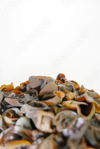 Fresh wood ear nushroom on white background,raw material for cooking. Close up. photo