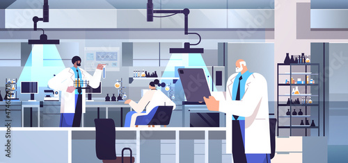 mix race research scientist team working with test tubes researchers making chemical experiments in laboratory