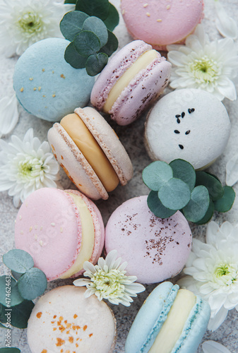 Beautiful colorful tasty macaroons on a concrete background