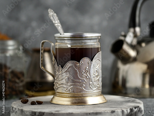 coffee in vintage glass on gray background 