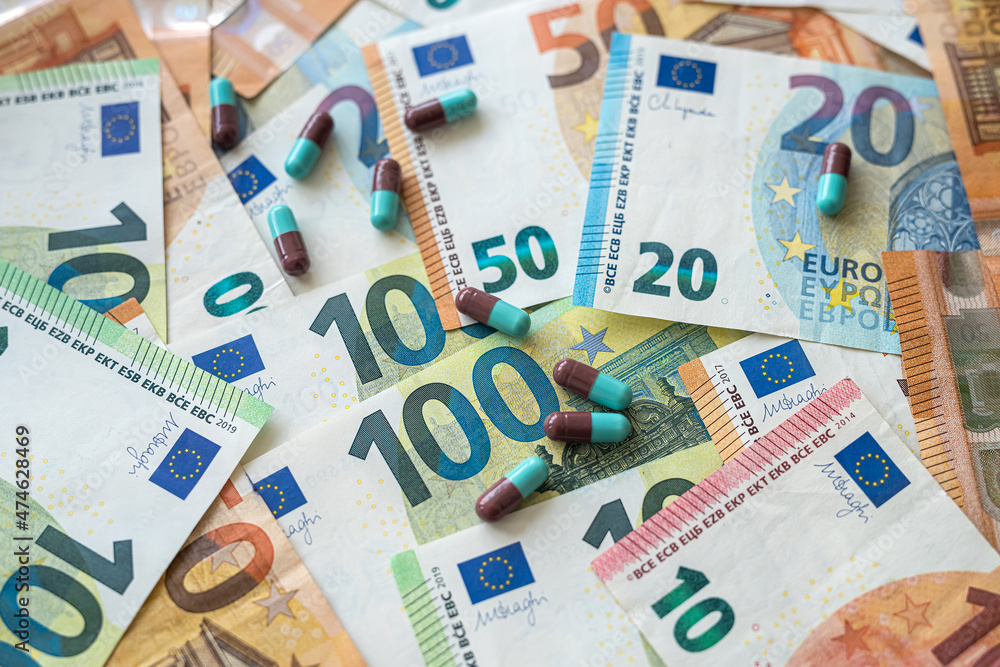 different pills medications with european money as background different pills medications with european money as background