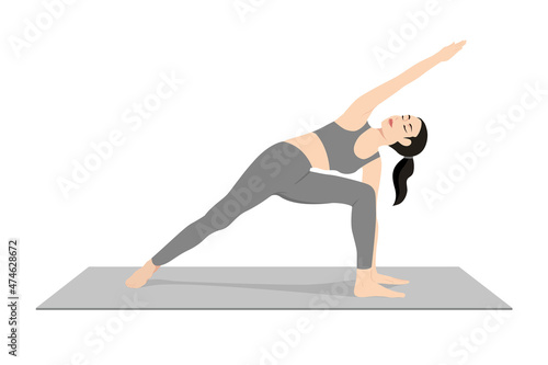 Extended Side Angle Pose, Beautiful girl practice Utthita Parsvakonasana. Young attractive woman practicing yoga exercise. working out, black wearing sportswear, grey pants and top, indoor full length