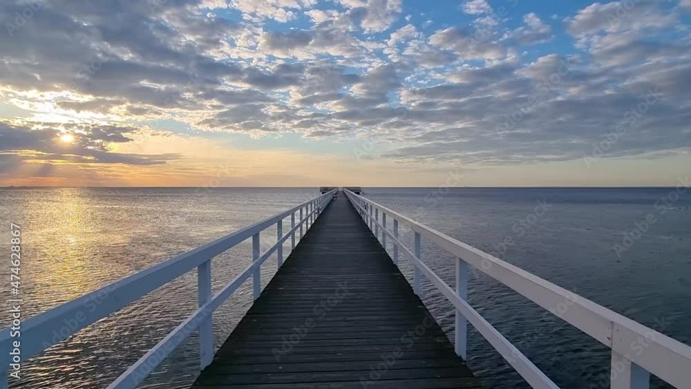 Wooden bridge at ocean, sunset Wooden bridge at ocean, sunset