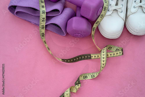 sports equipment among which the ball dumbbells rubber mats are laid out for sports