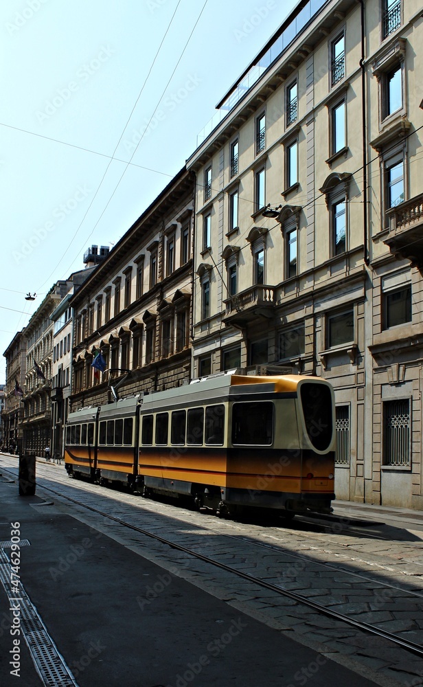 Italy, Milan: Orange tram.