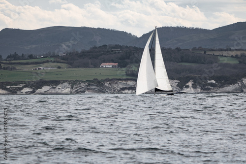 beautiful sailing boat cruising atlantic ocean on basque coastline, hendaye, france