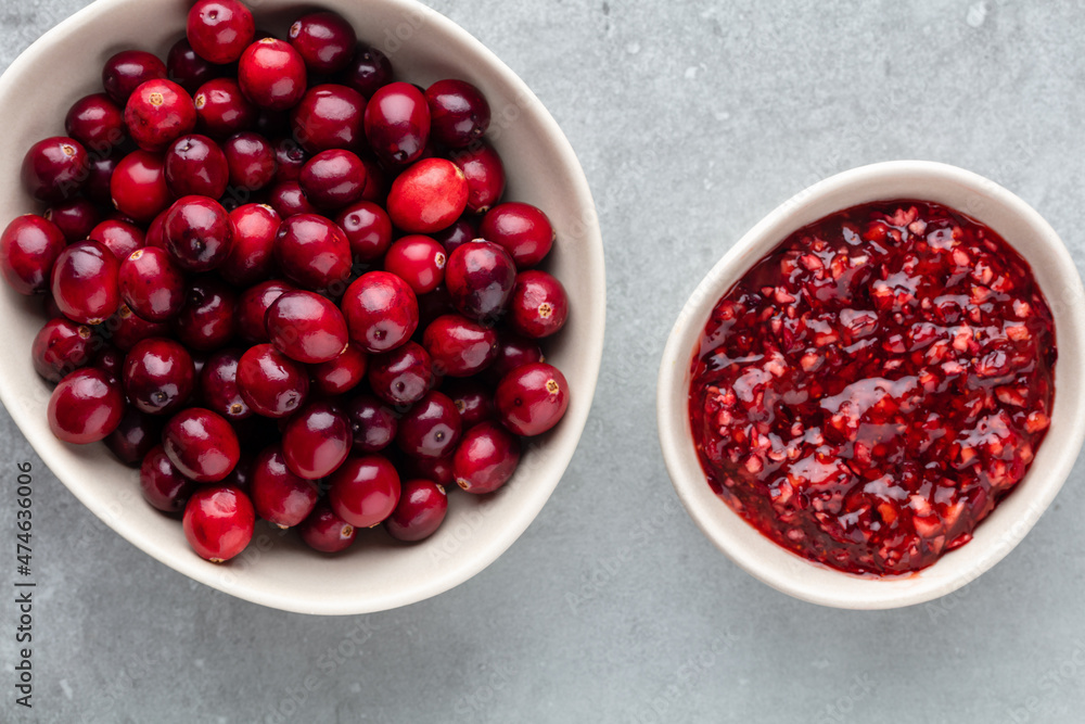 Red berries on a dark background. cranberries in a bowl. Red berries on a dark background. cranberries in a bowl.
