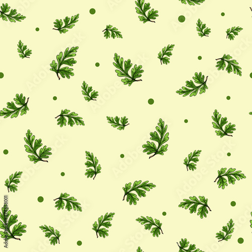 Seamless pattern with green leaves on a light yellow background