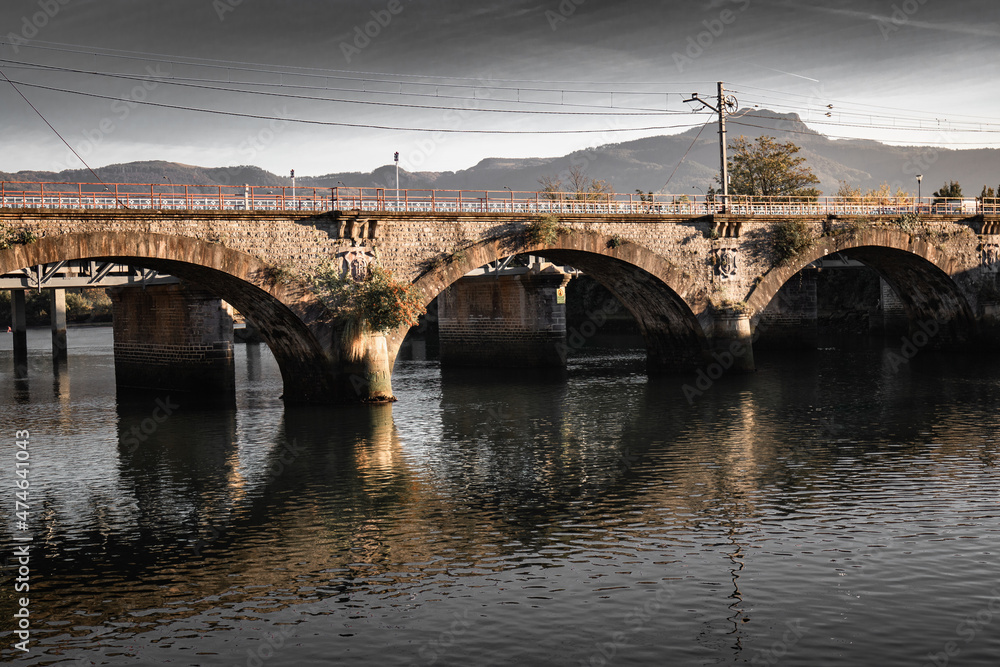 Fototapeta premium Old Bridge Saint Jacques over river Bidassoa on border with France and Spain